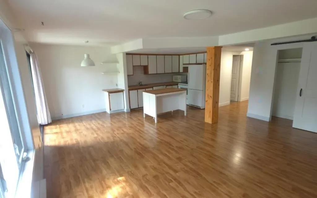 Aire ouverte du condo à vendre à Brossard : salon, salle à manger et cuisine